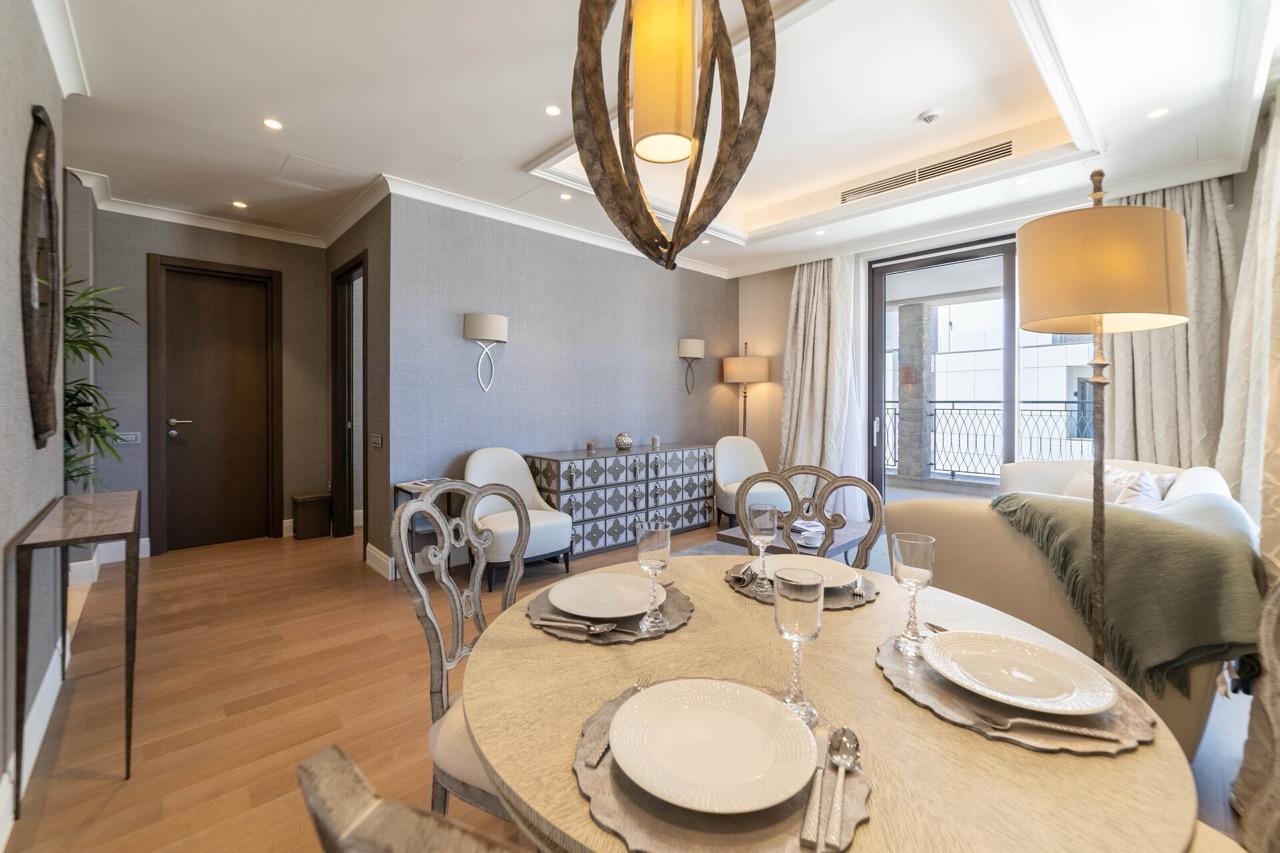 Living room in an apartment in Portonovi, Kumbor, Montenegro: dining area, designer furniture, and access to the terrace.