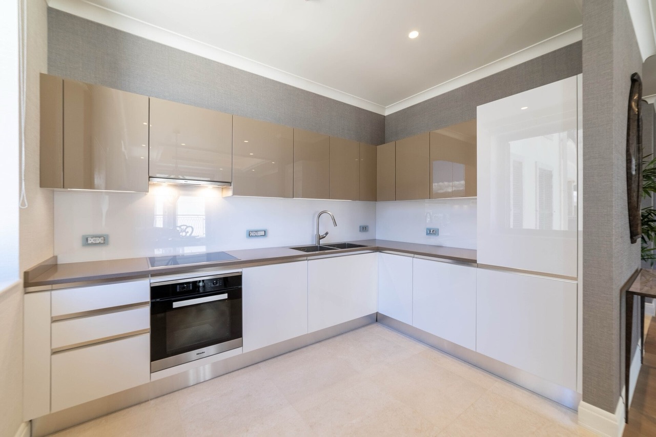 Modern kitchen with glossy fronts and Miele appliances in an apartment in Portonovi, Kumbor, Montenegro.