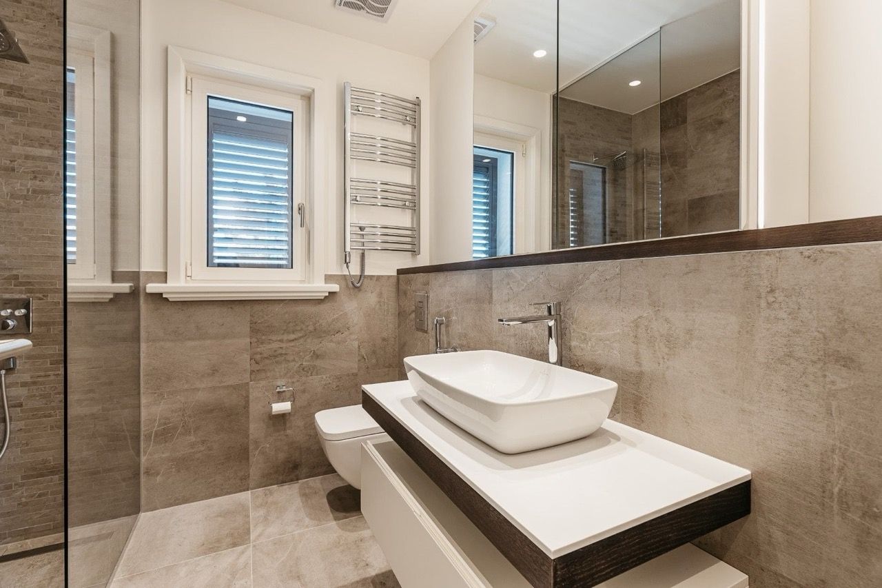 Modern bathroom with a shower and stylish finishes in an apartment in Luštica Bay, Radovići, Montenegro.