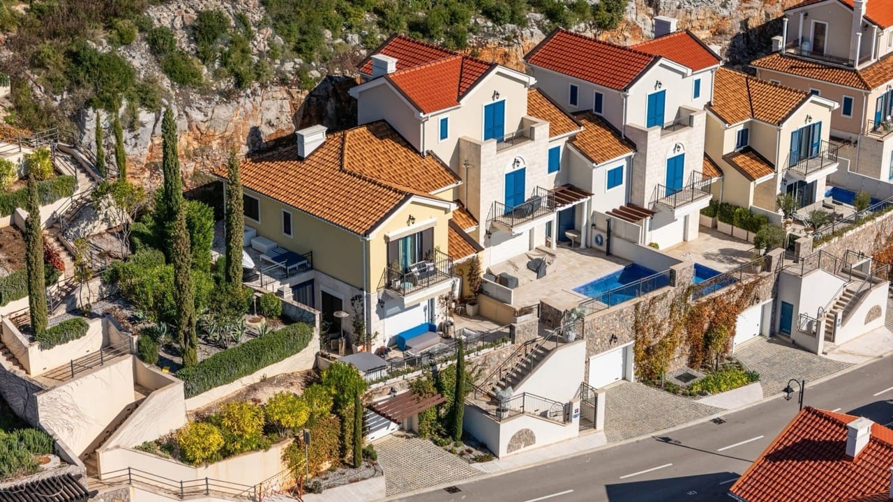 Villa in Luštica Bay, Radovići, Montenegro: view of the complex with terraces, pools, and landscaping.