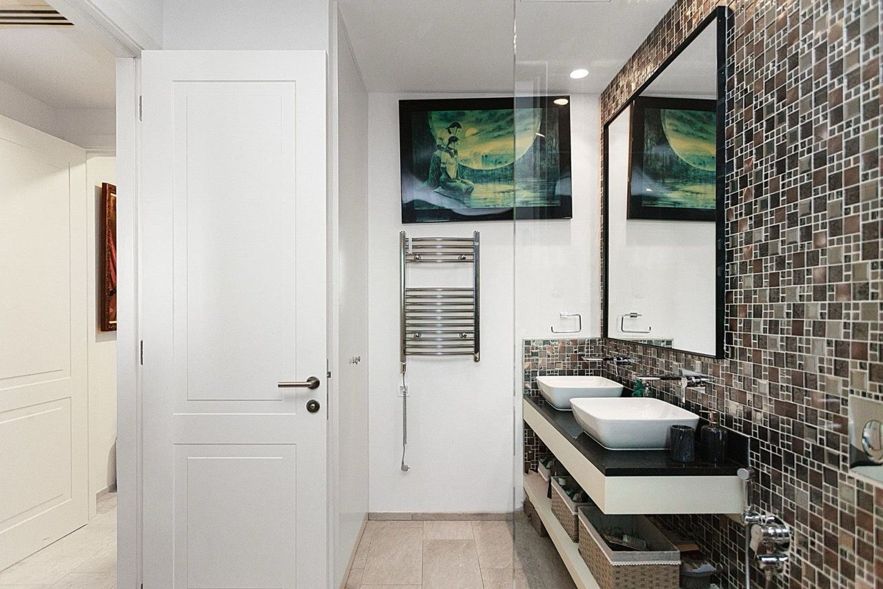 Modern bathroom with two sinks and mosaic tile in a villa in Luštica Bay, Radovići, Montenegro.