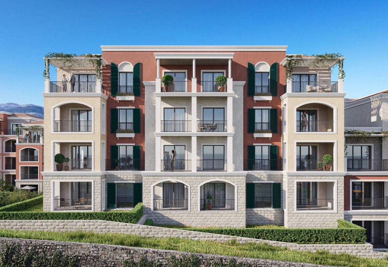 Modern residential complex in Luštica Bay, Radovići, Montenegro: building facade with terraces and green shutters.