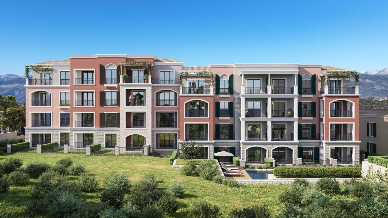 Modern residential complex in Luštica Bay, Radovići, Montenegro: building facade, terraces, and a swimming pool with mountains in the background.