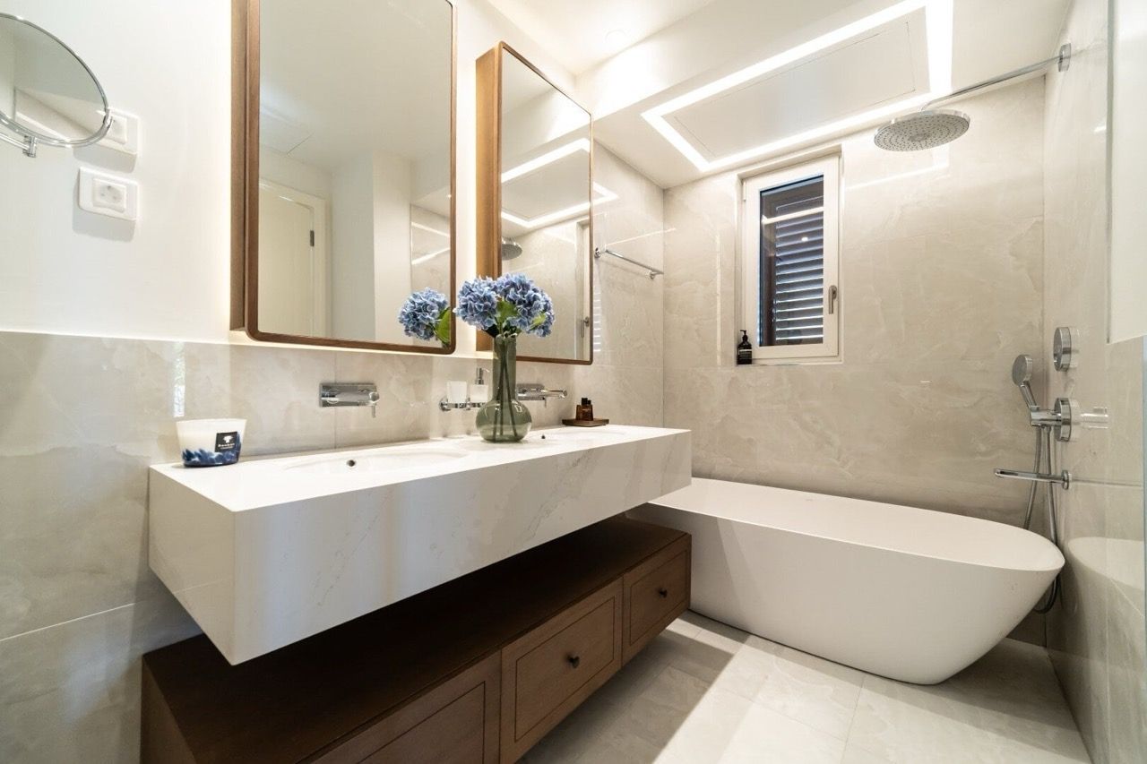 Modern bathroom in an apartment in Luštica Bay, Radovići, Montenegro: freestanding bathtub and stylish furniture.