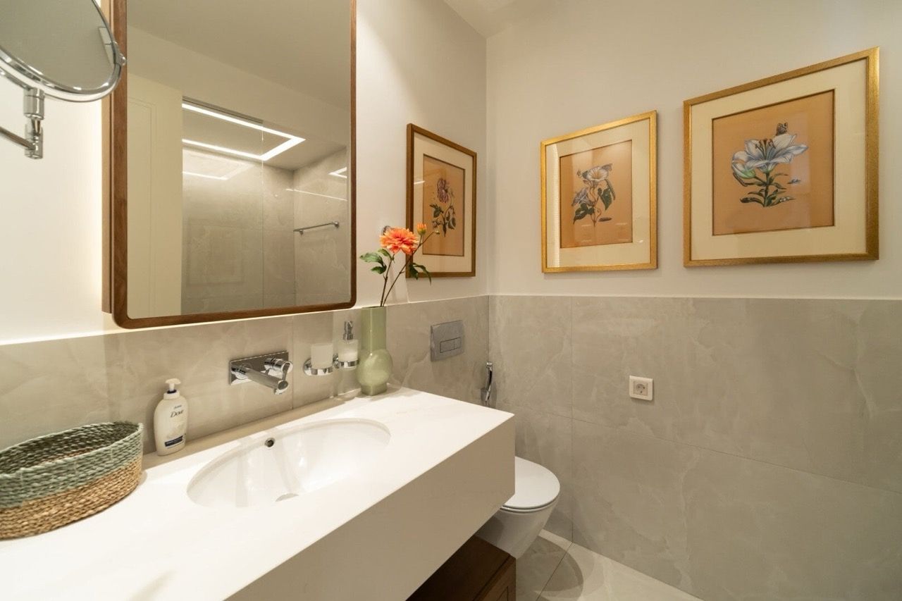 Modern bathroom in an apartment in Luštica Bay, Radovići, Montenegro: stylish finishes, mirror, and decor.