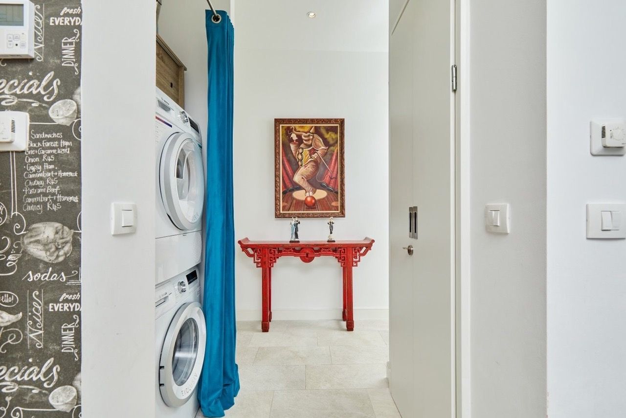 Utility area with appliances and a stylish interior in an apartment in Luštica Bay, Radovići, Montenegro.