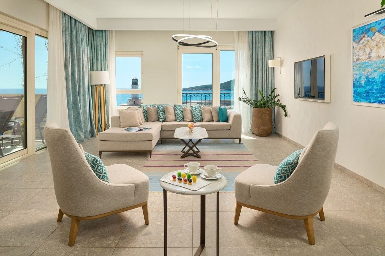 Bright living room in an apartment in Luštica Bay, Radovići, Montenegro, with sea and lighthouse views, modern furniture.
