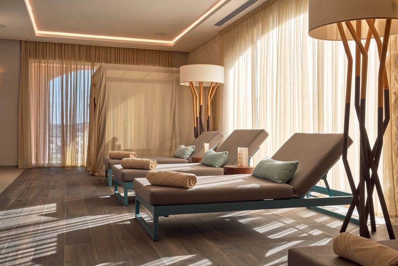 Relaxation area with sun loungers in the spa center of Lustica Bay apartments, Radovici, Montenegro: stylish interior and decor.