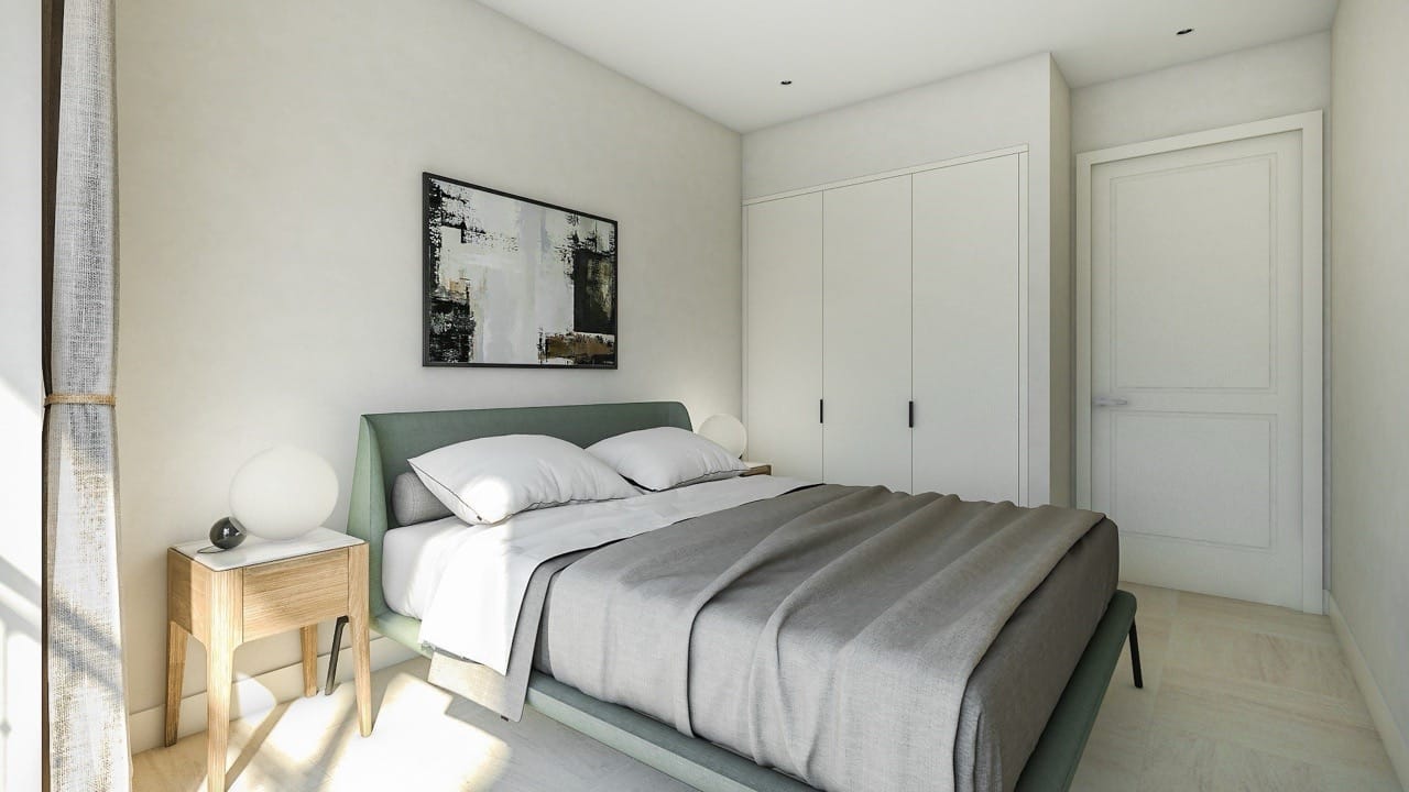 Modern bedroom with a double bed and built-in wardrobe in Luštica Bay apartments, Radovići, Montenegro.