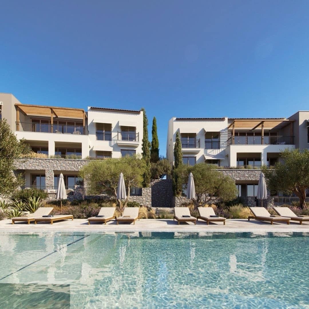 Pool and sun loungers by luxury residential villas in Luštica Bay, Radovići, Montenegro: modern architecture and landscaping.