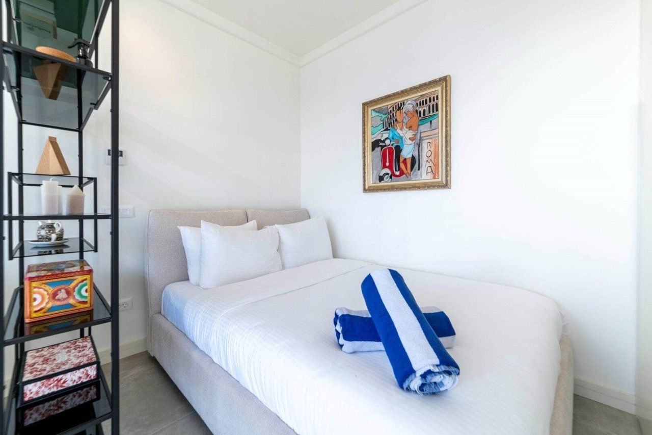Cozy bedroom with a double bed in an apartment, Luštica Bay, Radovići, Montenegro: modern interior and decor.