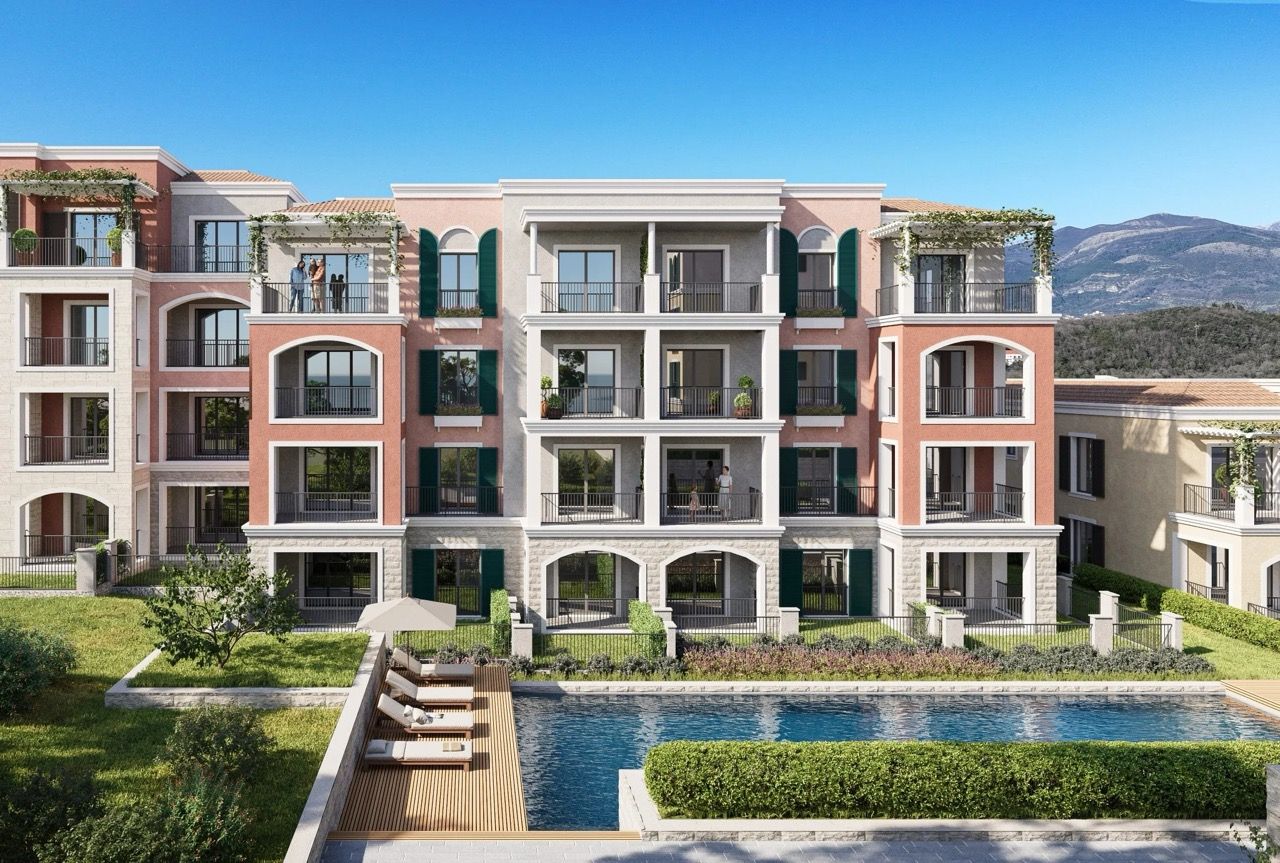 Modern residential complex in Luštica Bay, Radovići, Montenegro with a swimming pool, terraces, and mountain views.
