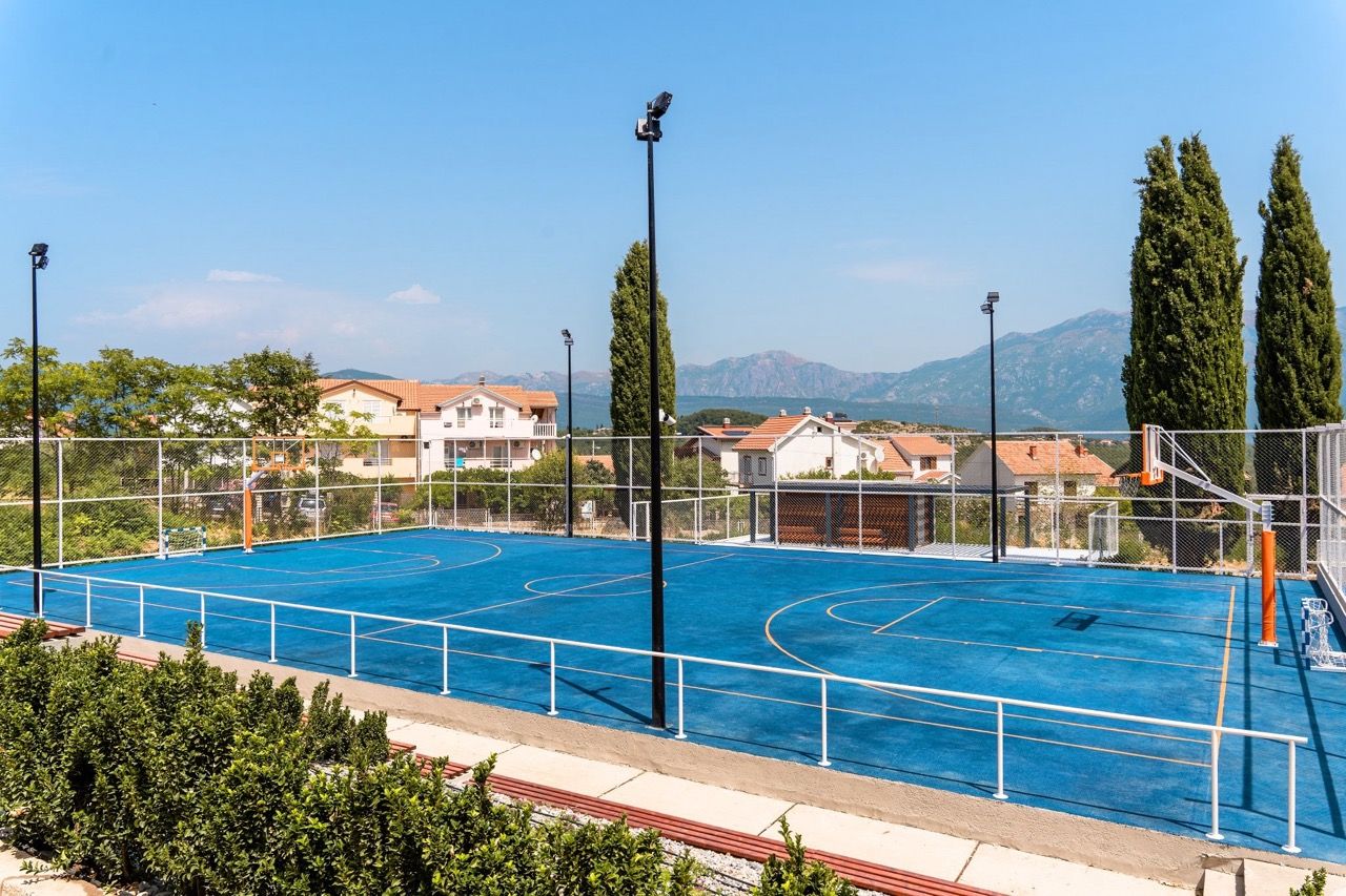 Universal sports court with blue surfacing in the Luštica Bay residential complex, Radovići, Montenegro.