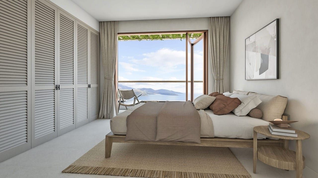 Modern bedroom in a villa in Luštica Bay, Radovići, Montenegro: sea view, wooden bed and louvered wardrobes.