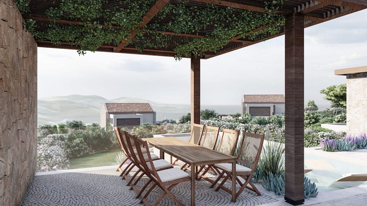 Villa terrace in Luštica Bay, Radovići, Montenegro: dining area under a pergola with sea and pool views.