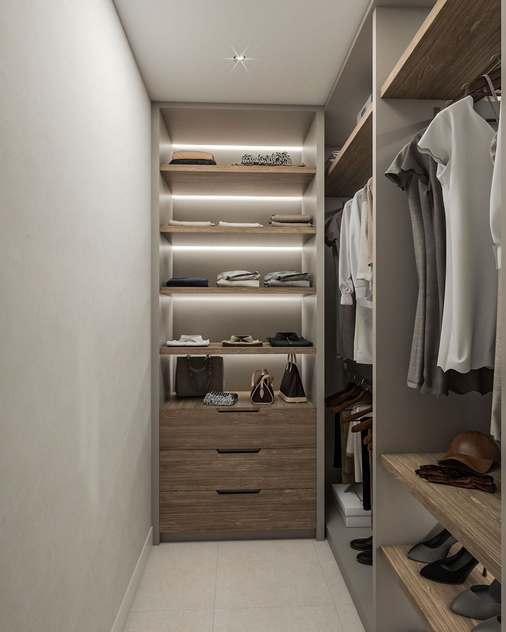Modern walk-in closet with shelf lighting and wooden drawers in a villa in Luštica Bay, Radovići, Montenegro.