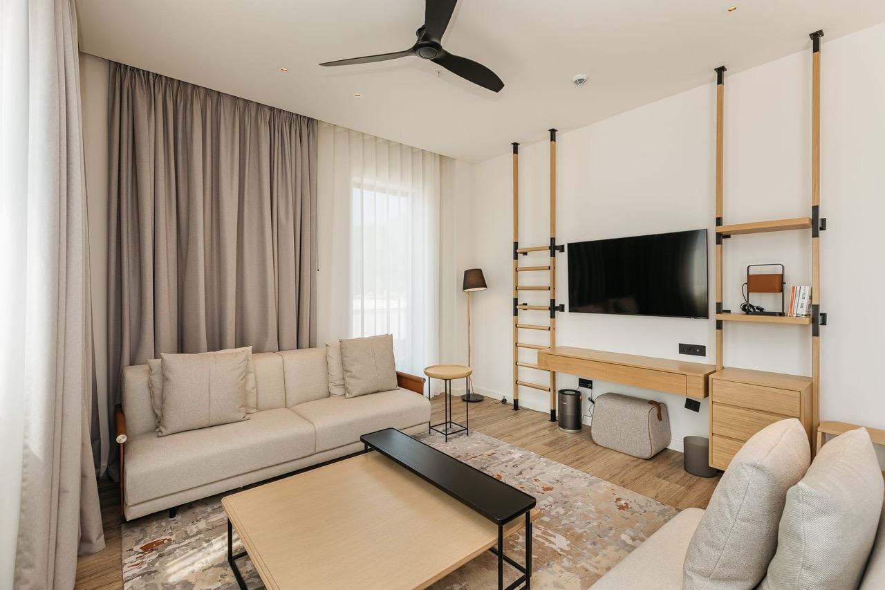 Modern living room in an apartment in Porto Montenegro, Tivat, Montenegro: light furniture, TV area, and stylish interior.