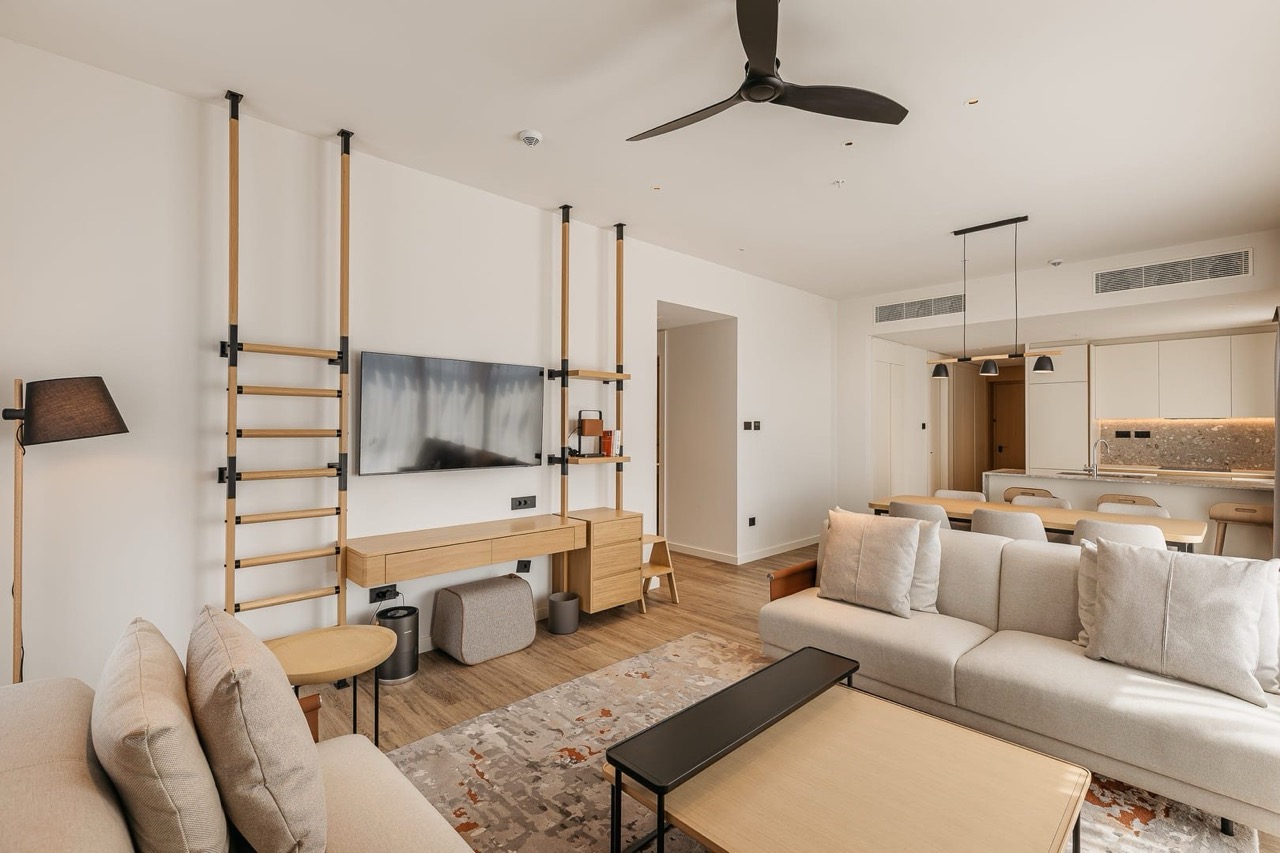 Modern living room with kitchen in an apartment, Porto Montenegro, Tivat, Montenegro: bright interior, designer furniture.