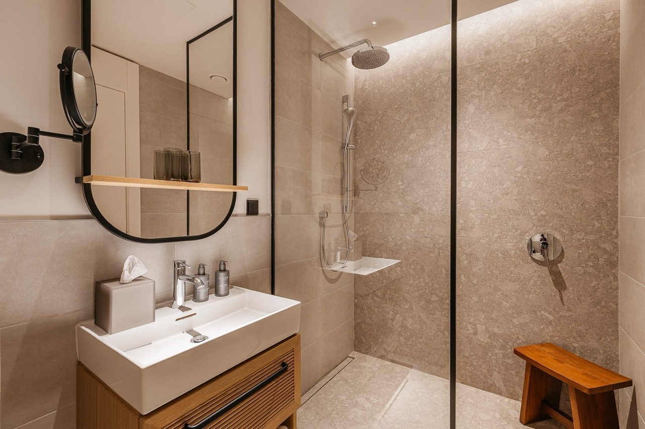 Modern bathroom with a shower cabin in the Porto Montenegro apartments, Tivat, Montenegro. High-quality finishes.