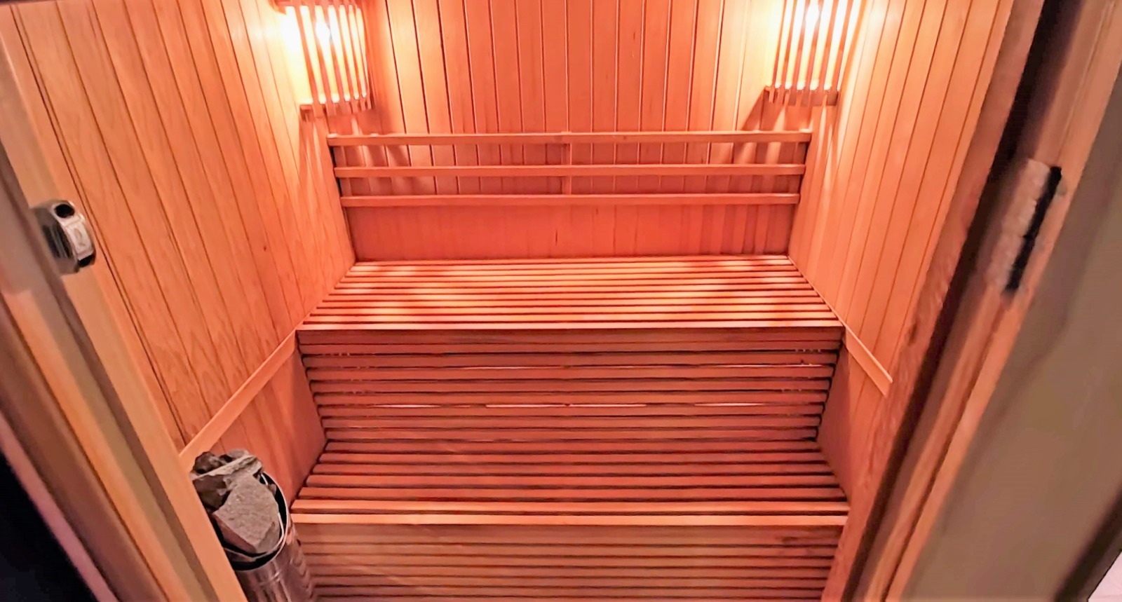 Sauna interior with light wood finish and built-in lighting in a villa in Bar, Montenegro.