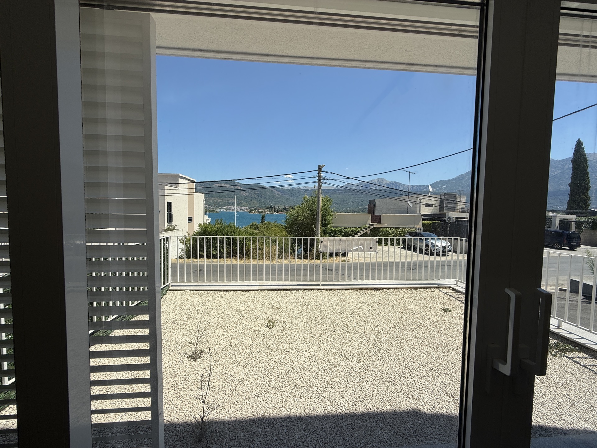 Sea and mountain view from the window of a townhouse in the Đuraševići settlement, Luštica Peninsula, Montenegro.