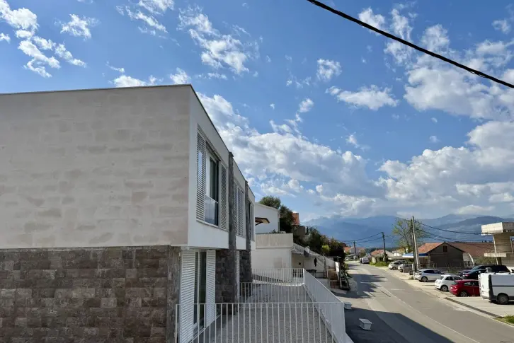 Modern townhouse with stone facade cladding and a terrace in Luštica, Montenegro