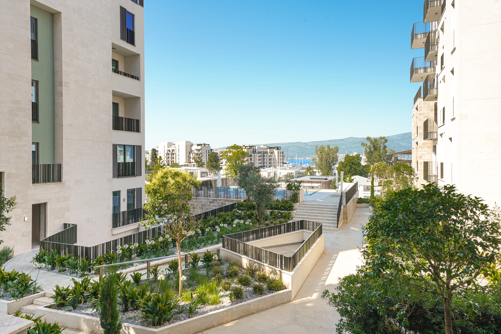 Modern residential complex with landscaped grounds and a swimming pool in Porto Montenegro, Tivat, Montenegro.