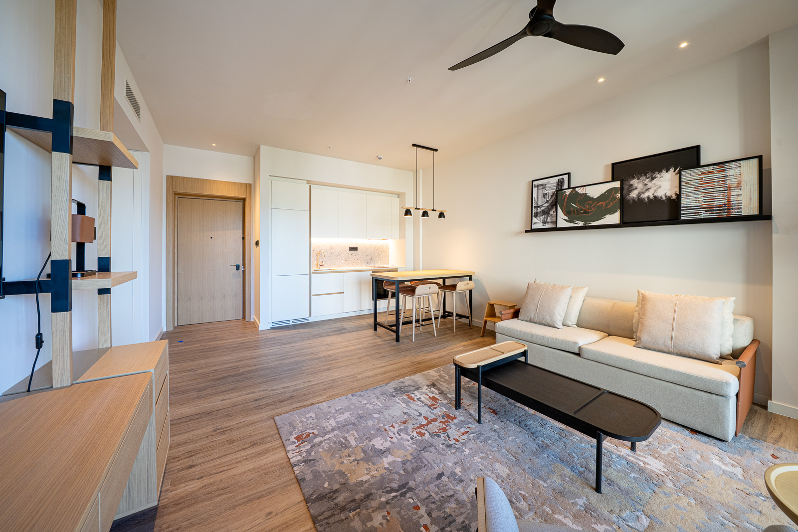 Modern living room with kitchen in Porto Montenegro apartments, Tivat, Montenegro: bright interior, loft-style furniture.