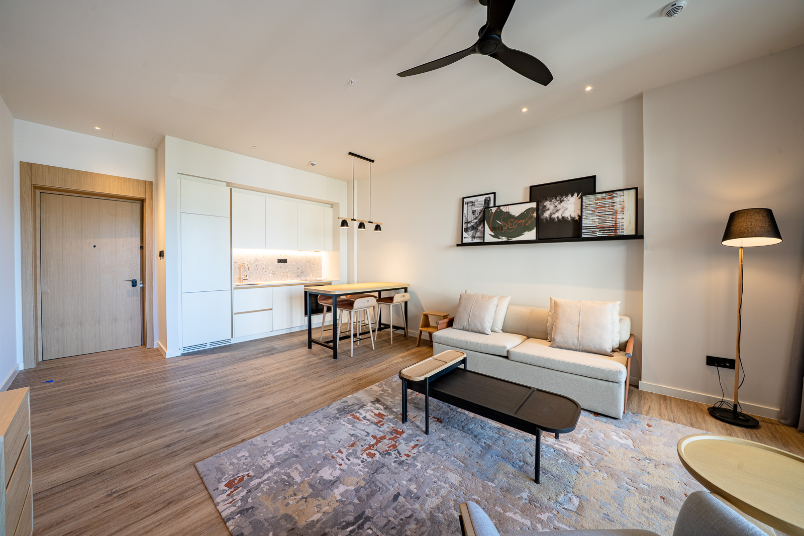 Modern living room with kitchen in Porto Montenegro apartments, Tivat, Montenegro: stylish furniture and bright interior.