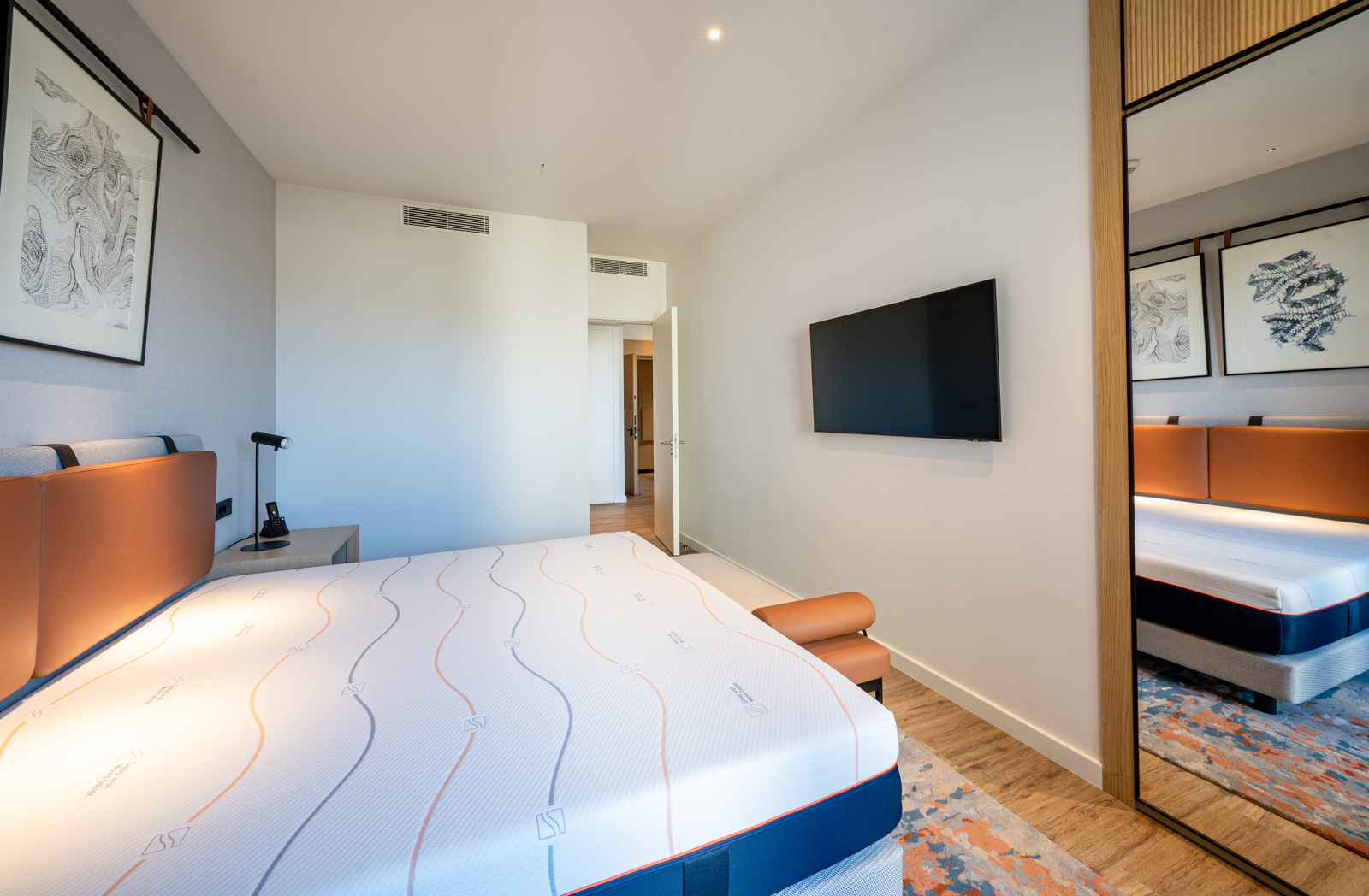 Modern bedroom with a double bed in Porto Montenegro apartments, Tivat, Montenegro.