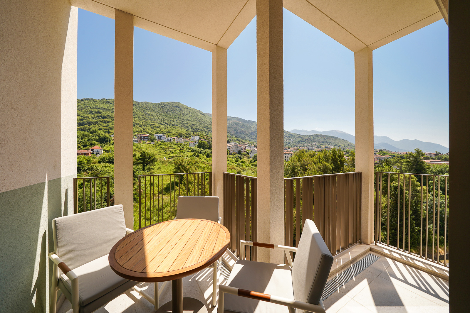 Terrace with furniture and panoramic mountain views in an apartment in Porto Montenegro, Tivat, Montenegro.