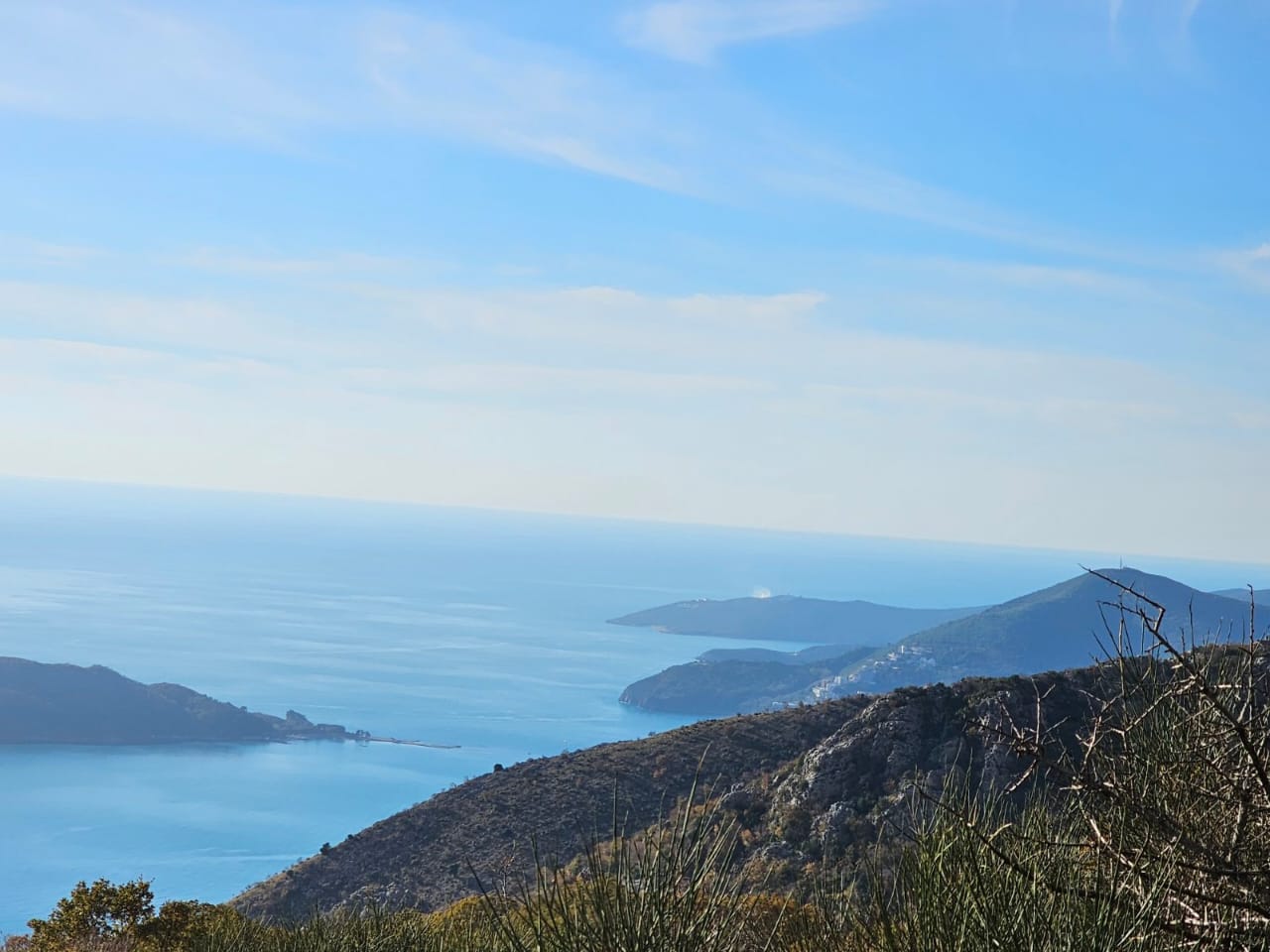 Panoramic view of the Adriatic Sea and mountains from a plot of land in Kuljača, Budva Riviera, Montenegro.