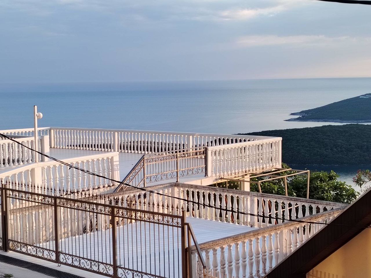 Spacious terrace with balustrade and panoramic sea view in Sutomore, Montenegro. Apartment with an open terrace.