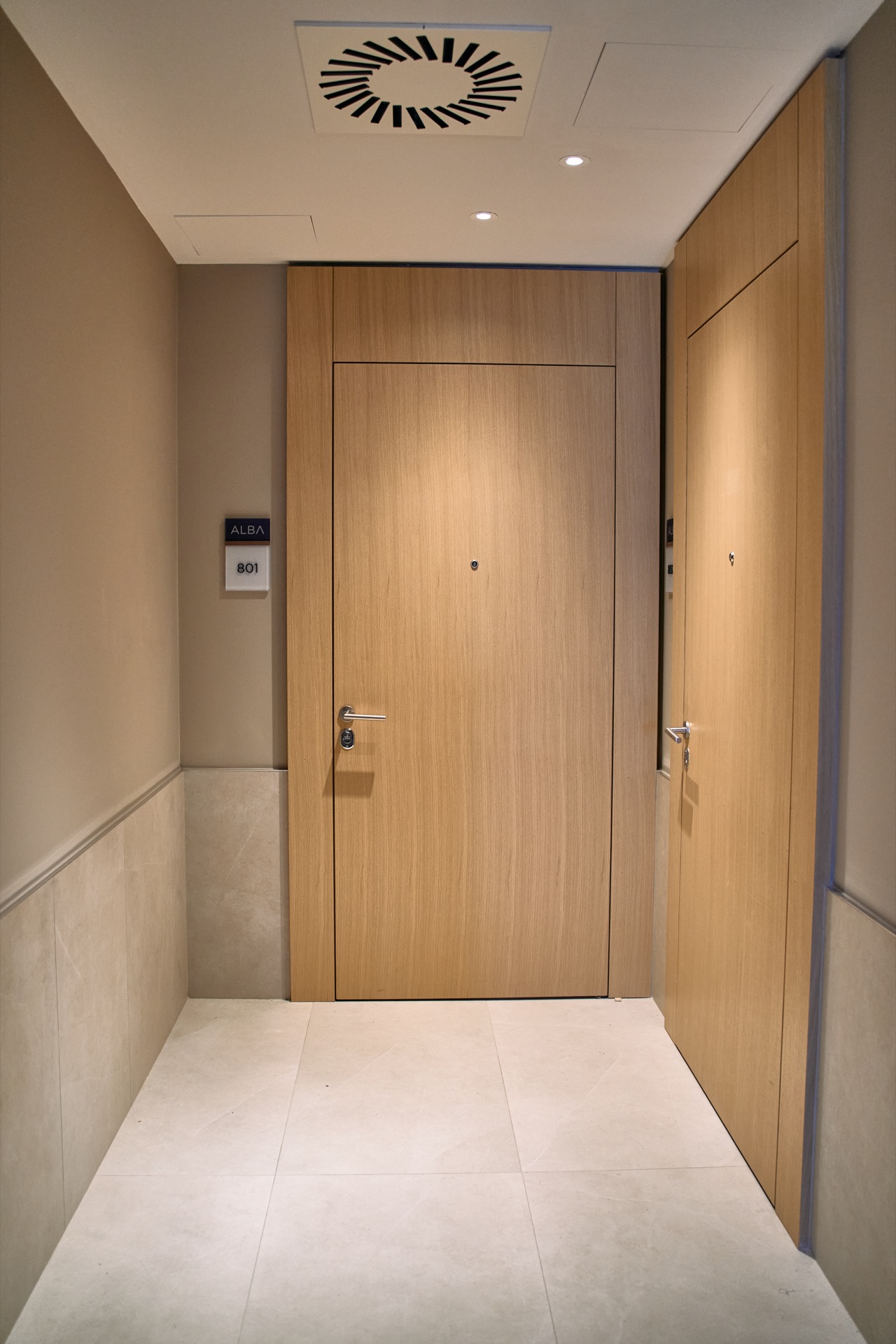 Modern hallway with wooden doors in the Porto Montenegro apartments, Tivat, Montenegro.