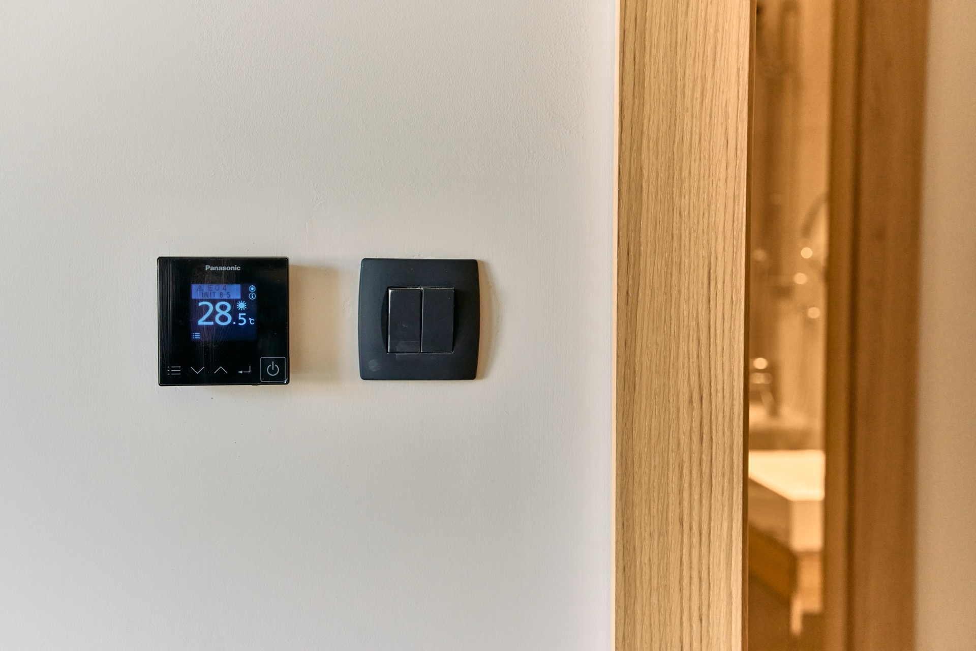 Panasonic thermostat and light switch in a modern apartment in Porto Montenegro, Tivat, Montenegro.