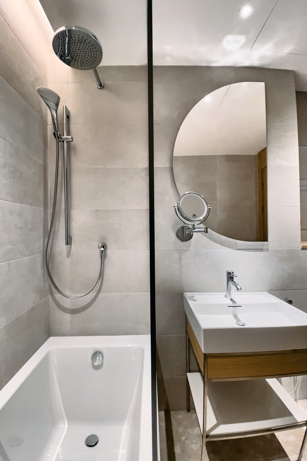 Modern bathroom with a shower and a stylish sink in an apartment in Porto Montenegro, Tivat, Montenegro.