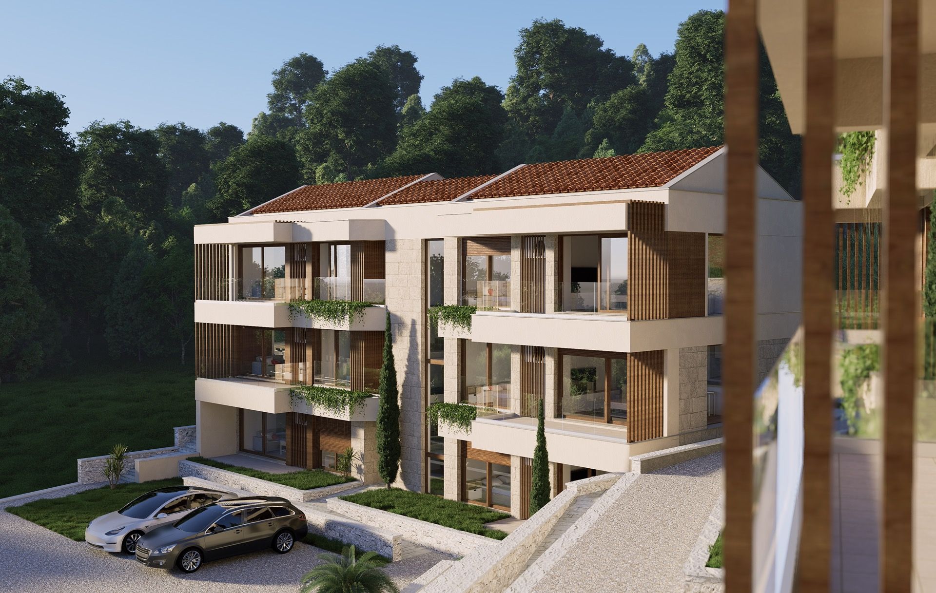 Modern residential complex with terraces and parking in Blizikuće, Montenegro: view of the building facade with landscaping.