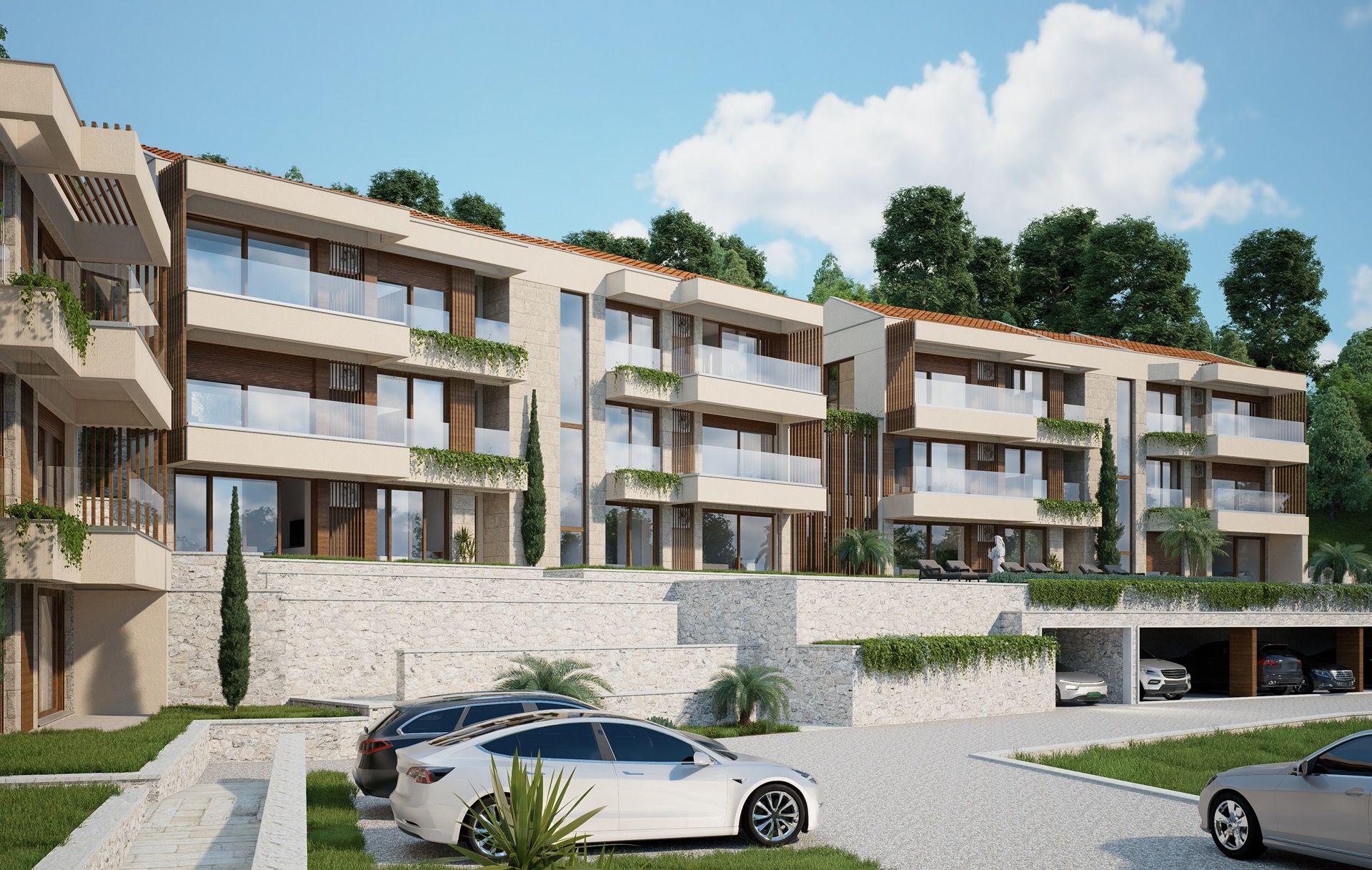 Modern residential complex in Blizikuće, Montenegro: facade with terraces, panoramic glazing, and parking by the building.