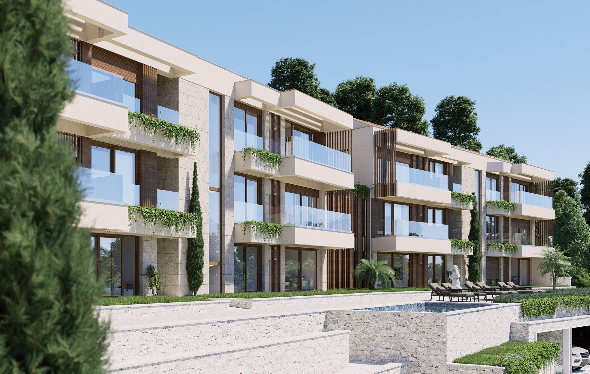 Modern residential complex with a pool and terraces in Blizikuće, Montenegro: facade with panoramic glazing.