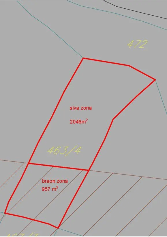 Cadastral map of a land plot with red boundaries showing gray zone 2046 sqm and brown zone 957 sqm.
