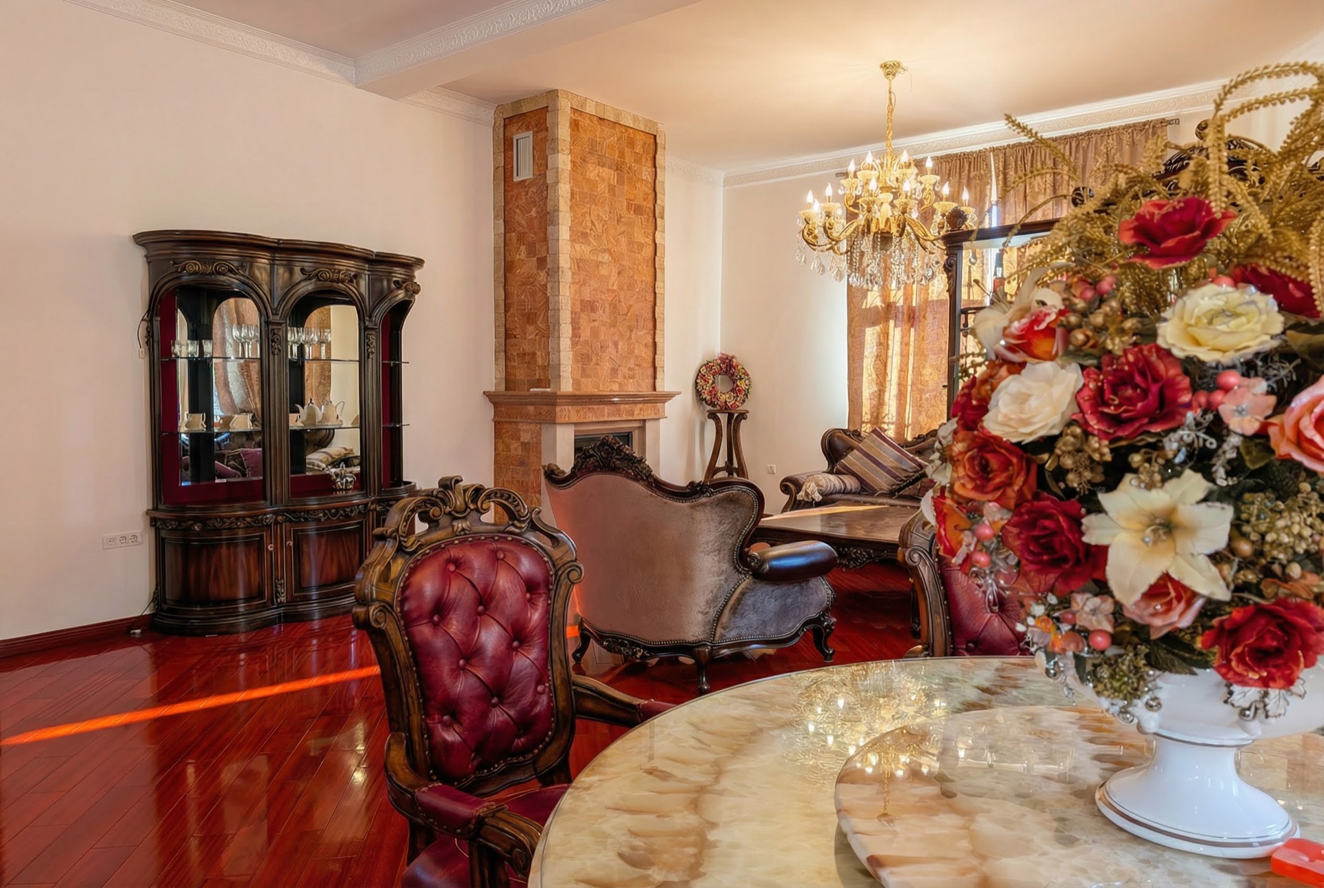 Luxurious living room with a fireplace and classic furniture in a villa in Luštica Bay, Montenegro: interior with antique decor.