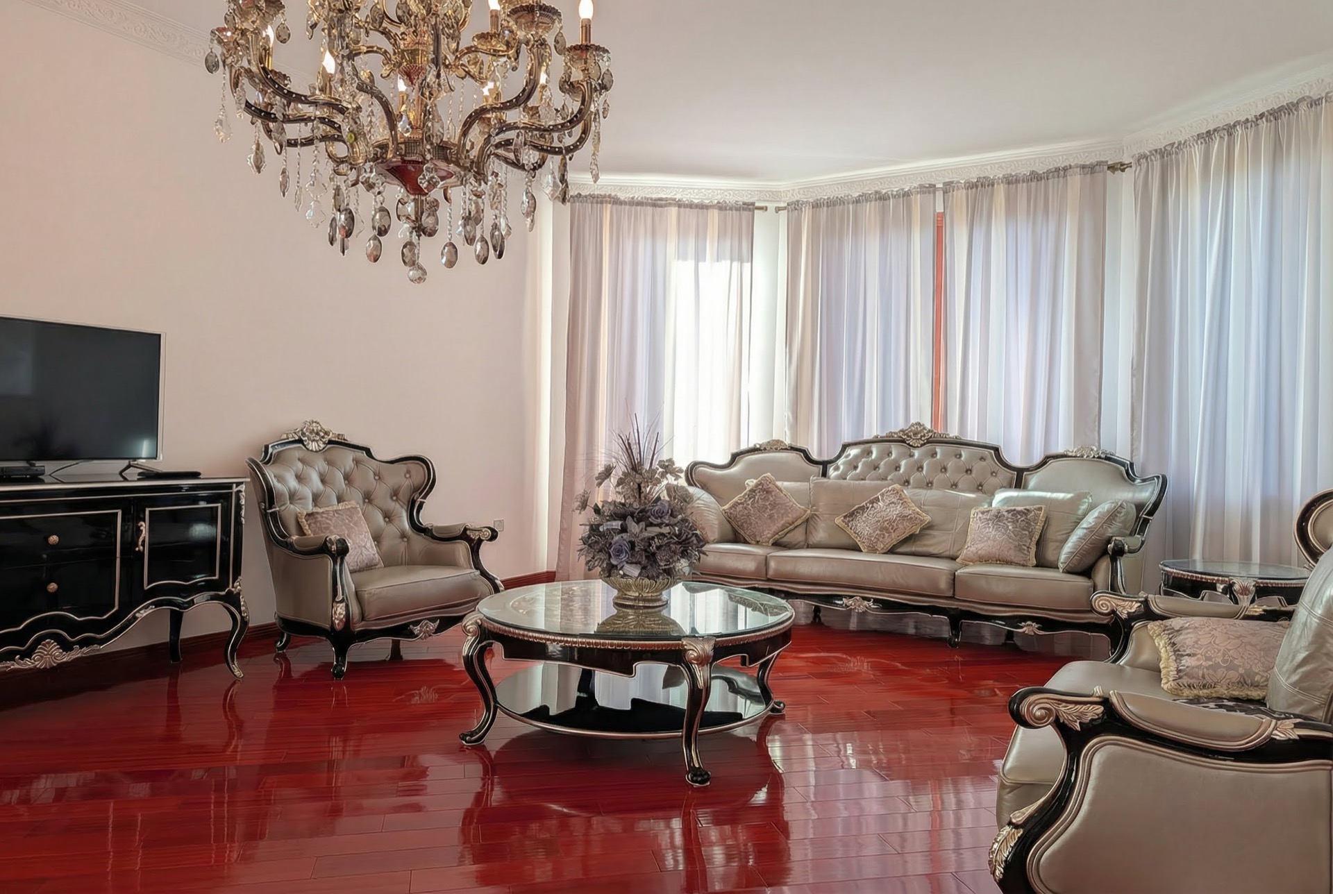 Luxurious living room with classic furniture and a crystal chandelier in a villa in Luštica, Montenegro.