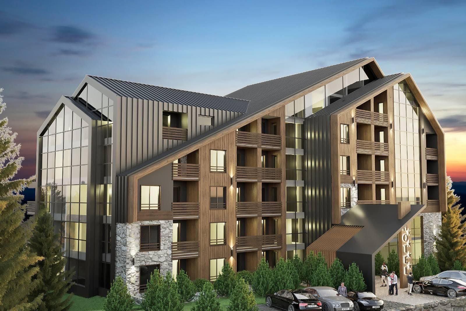 Modern hotel in Kolašin, Montenegro: a wood and stone facade with panoramic glazing and balconies.