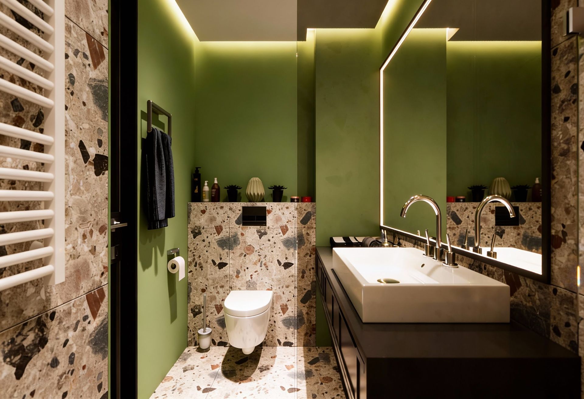 Modern bathroom in an apartment in Kolašin, Montenegro: terrazzo finish, green wall, and backlit mirror.
