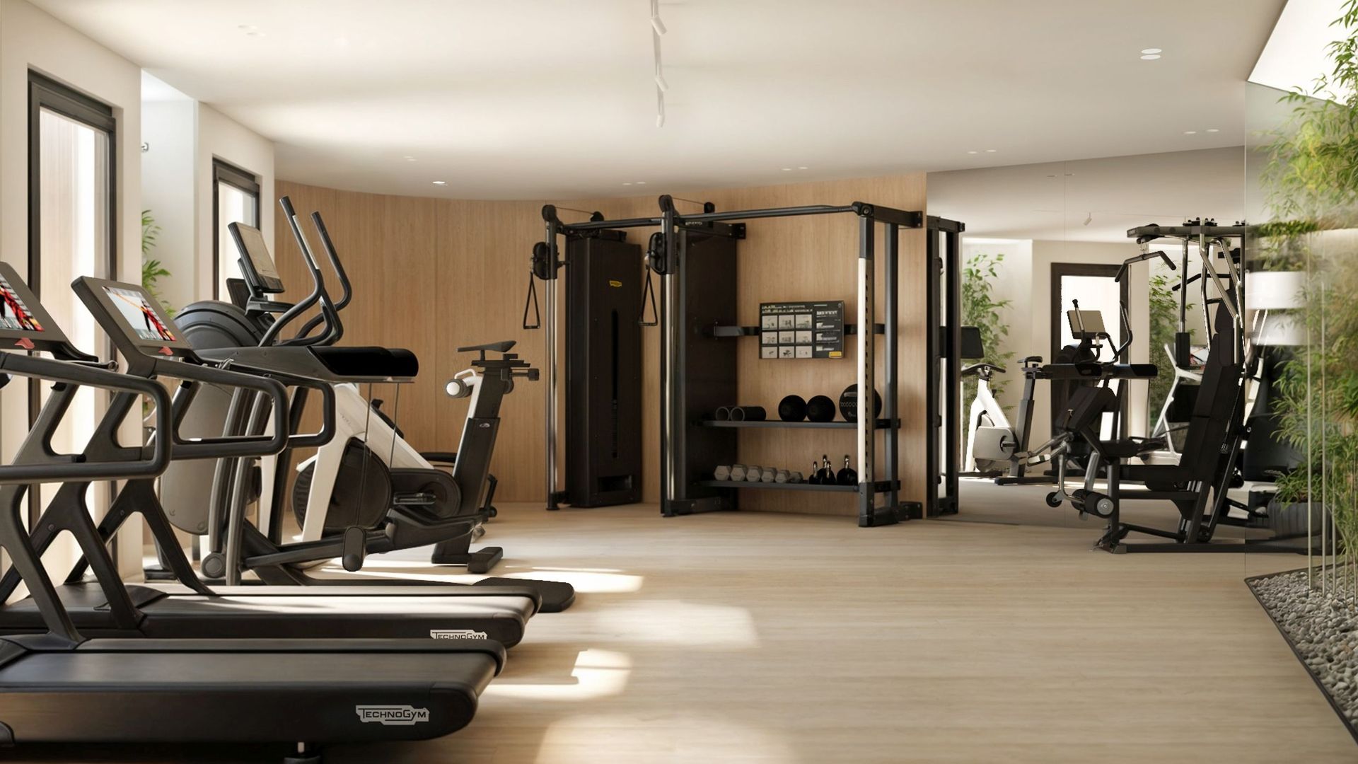 Modern gym with Technogym equipment in a residential complex in Reževići, Montenegro.