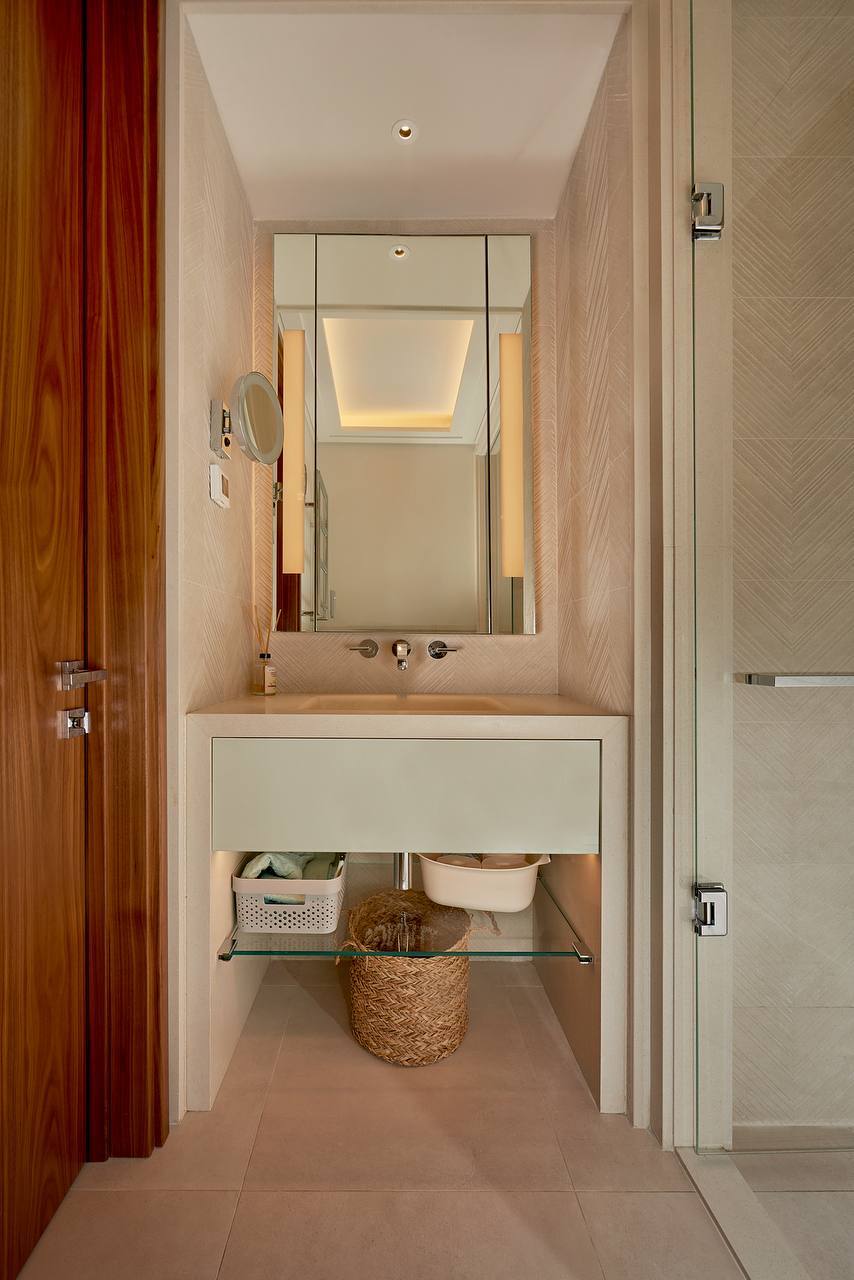 Modern bathroom in an apartment in Porto Montenegro, Tivat, Montenegro: stylish sink and backlit mirror.