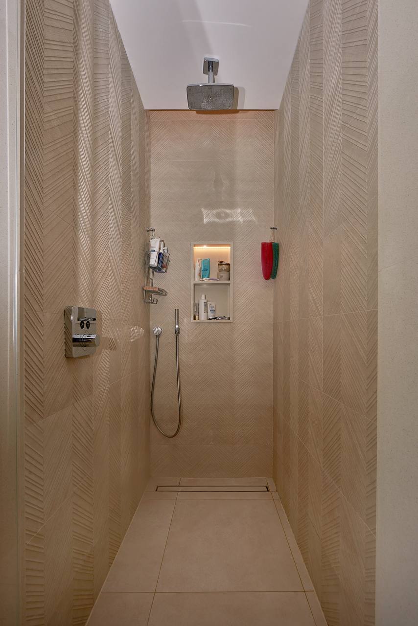 Modern shower cabin with a rain shower and niche in an apartment, Porto Montenegro, Tivat, Montenegro.