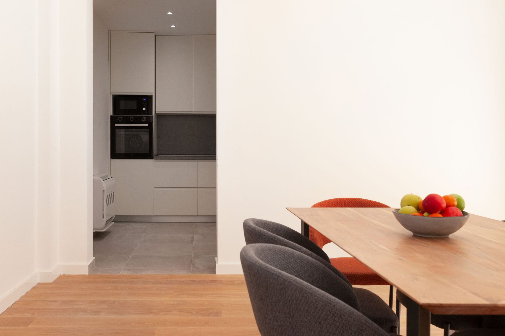 Modern living room with dining area and built-in kitchen in an apartment in Kotor, Montenegro.