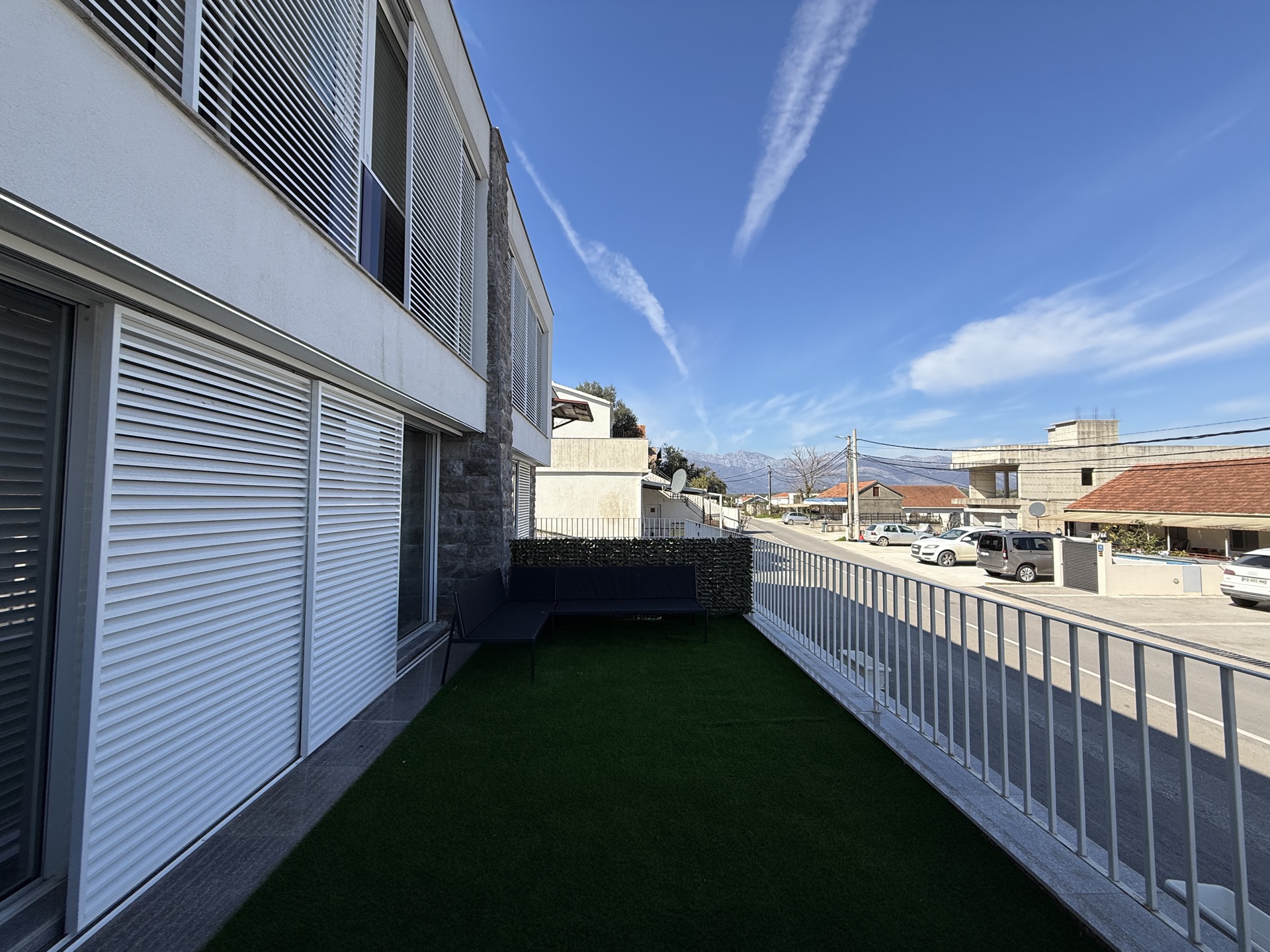 Spacious townhouse balcony in Đuraševići with artificial grass and furniture, Luštica, Montenegro