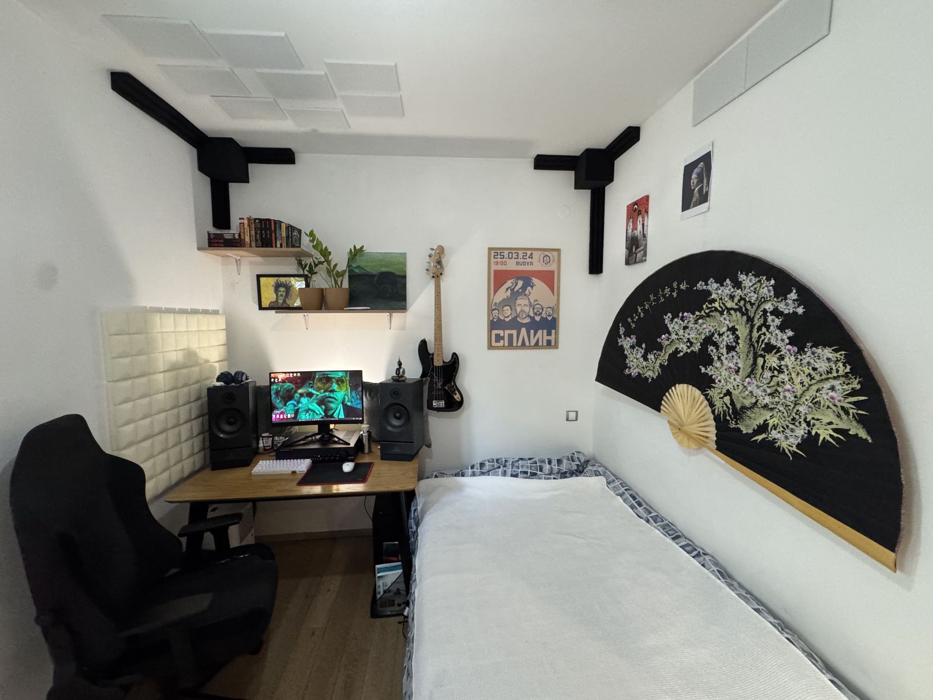 Cozy bedroom with a workspace and bed in an apartment, Dobrota, Montenegro: stylish interior with decor.